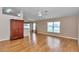 Bright living room features hardwood floors, neutral walls, and a ceiling fan at 8127 Sw 60Th Ct, Ocala, FL 34476