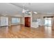 Open-concept living space with hardwood flooring, high ceilings, and natural light at 8127 Sw 60Th Ct, Ocala, FL 34476
