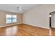 Spacious main bedroom featuring hardwood floors, vaulted ceilings, and natural light at 8127 Sw 60Th Ct, Ocala, FL 34476