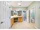 Bathroom featuring tile flooring, vanity with double sinks, and a view of the toilet and closet at 8632 Sw 86Th Cir, Ocala, FL 34481