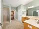 Bathroom with tile flooring, a double sink vanity, shower and walk-in closet at 8632 Sw 86Th Cir, Ocala, FL 34481
