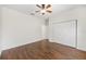 Empty bedroom with ceiling fan, wood floors and closet at 8632 Sw 86Th Cir, Ocala, FL 34481