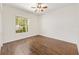 Bedroom with wood floors and a window with natural light at 8632 Sw 86Th Cir, Ocala, FL 34481