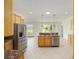 Spacious kitchen with stainless steel appliances, granite countertops, and bright lighting at 8632 Sw 86Th Cir, Ocala, FL 34481