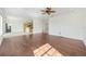Spacious living room featuring hardwood floors with a view of the open kitchen at 8632 Sw 86Th Cir, Ocala, FL 34481