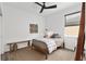Bedroom with a modern ceiling fan and textured wall art at 8798 Sw 79Th Pl, Ocala, FL 34481