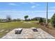 Outdoor cornhole area with manicured lawns, providing a fun and relaxing recreational space at 8798 Sw 79Th Pl, Ocala, FL 34481