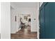 Welcoming entryway with hardwood floors leading to a bright office space with modern decor at 8798 Sw 79Th Pl, Ocala, FL 34481