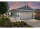 Charming single-story home featuring a two-car garage, lovely landscaping, and a covered entryway at 8798 Sw 79Th Pl, Ocala, FL 34481