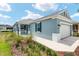 Charming single-story home featuring a two-car garage, lovely landscaping, and a covered entryway at 8798 Sw 79Th Pl, Ocala, FL 34481
