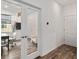 Inviting hallway leading to an office space with a glass door and hardwood floors at 8798 Sw 79Th Pl, Ocala, FL 34481