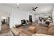 Spacious living room with an open layout, modern decor, and access to the kitchen and other living spaces at 8798 Sw 79Th Pl, Ocala, FL 34481