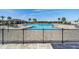 Community pool featuring ample seating, shaded areas, and palm trees for a resort-like experience at 8798 Sw 79Th Pl, Ocala, FL 34481
