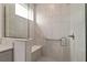 Shower with a glass partition, bench, and grab bar for accessibility and safety at 8798 Sw 79Th Pl, Ocala, FL 34481