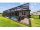 This screened pool and patio area offer serene outdoor enjoyment within the fenced green backyard at 8875 Sw 58Th Street Rd, Ocala, FL 34481