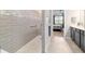 Modern bathroom showcasing a glass-enclosed shower, gray vanity, and neutral color palette at 8875 Sw 58Th Street Rd, Ocala, FL 34481
