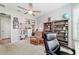 Bright bedroom with bookshelves, a ceiling fan, neutral carpeting, and lots of room for relaxing at 8875 Sw 58Th Street Rd, Ocala, FL 34481