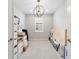 Bedroom showcasing a modern light fixture and filled with boxes and items, offering customizable space at 8875 Sw 58Th Street Rd, Ocala, FL 34481