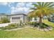 Charming single-story home with well-manicured lawn, lush landscaping, and a two-car garage at 8875 Sw 58Th Street Rd, Ocala, FL 34481