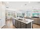 Open-concept kitchen with an island that flows into the living and dining area at 8875 Sw 58Th Street Rd, Ocala, FL 34481