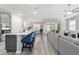 Bright, open-concept living area with a center island, lots of seating, and natural light at 8875 Sw 58Th Street Rd, Ocala, FL 34481