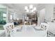 Bright open-concept living space featuring a gourmet kitchen and access to a covered outdoor living area at 8875 Sw 58Th Street Rd, Ocala, FL 34481