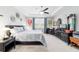Large main bedroom featuring neutral decor, ceiling fan, and large windows for lots of natural light at 8875 Sw 58Th Street Rd, Ocala, FL 34481