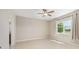 Bright bedroom with large window providing natural light and a ceiling fan at 8952 Sw 79Th Ln, Ocala, FL 34481