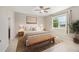 Staged bedroom with stylish furniture, neutral tones, and a view of the outdoors at 8952 Sw 79Th Ln, Ocala, FL 34481