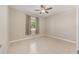 Simple bedroom with a large window allowing natural light, and neutral decor at 8952 Sw 79Th Ln, Ocala, FL 34481