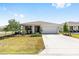 Charming single-story home featuring a well-manicured lawn and attached two-car garage at 8952 Sw 79Th Ln, Ocala, FL 34481