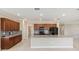 Spacious kitchen featuring a large island, granite countertops, and stainless steel appliances at 8952 Sw 79Th Ln, Ocala, FL 34481