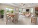 Open-concept kitchen, living, and dining area filled with natural light at 8952 Sw 79Th Ln, Ocala, FL 34481