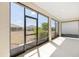 Enclosed patio with screen windows offering views of the backyard and neighborhood at 8952 Sw 79Th Ln, Ocala, FL 34481
