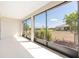Covered and screened patio featuring a serene outdoor view of the backyard and neighboring houses at 8952 Sw 79Th Ln, Ocala, FL 34481