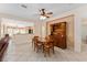 Open concept dining room with a ceiling fan and views to the kitchen at 9175 Se 118Th Loop, Summerfield, FL 34491