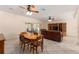 Open concept dining room with tile flooring and a dining table with four chairs at 9175 Se 118Th Loop, Summerfield, FL 34491