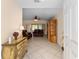 Inviting foyer featuring tile flooring, a decorative dresser and views into the living room at 9175 Se 118Th Loop, Summerfield, FL 34491