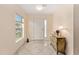 Inviting foyer with tile flooring and decorative dresser at 9175 Se 118Th Loop, Summerfield, FL 34491