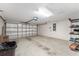 Spacious two-car garage with ample storage space and an automatic garage door opener at 9175 Se 118Th Loop, Summerfield, FL 34491