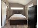 Comfortable bedroom showcasing a queen-sized bed and a stylish dresser, offering a relaxing retreat at 942 Ne 5Th St, Ocala, FL 34470