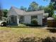 Attractive home showcasing a well-maintained yard and traditional siding at 942 Ne 5Th St, Ocala, FL 34470