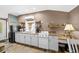 Functional kitchen with white cabinets and a compact design, ideal for efficient meal preparation at 942 Ne 5Th St, Ocala, FL 34470