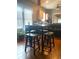 Bright kitchen with high top table, four stools and natural light from the large windows at 942 Ne 5Th St, Ocala, FL 34470