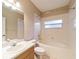 Bright bathroom featuring a shower-tub combo and a vanity with a large mirror at 9525 Sw 53Rd Cir, Ocala, FL 34476