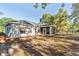 The home features a screened in porch and fenced backyard at 9525 Sw 53Rd Cir, Ocala, FL 34476