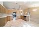 Well-equipped kitchen with stainless steel appliances, granite countertops, tile floor, and ample cabinet space at 9525 Sw 53Rd Cir, Ocala, FL 34476