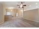 Spacious living room with an open layout, high ceilings, and plush carpeting at 9525 Sw 53Rd Cir, Ocala, FL 34476