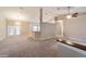 Bright and airy living room featuring neutral color palette, high ceilings, and ceiling fans at 9525 Sw 53Rd Cir, Ocala, FL 34476