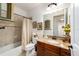 Bathroom featuring a granite vanity top and decorative wall art at 9532 Sw 70Th Loop, Ocala, FL 34481